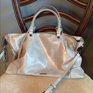 Rebecca minkoff purse has handles and a long strap